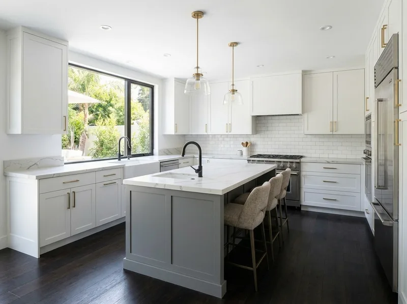 Transitional kitchen with shaker cabinets, quartz counters, and mixed metals
